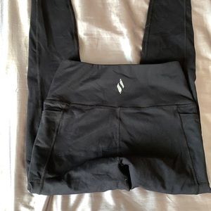 Black leggings with side pockets.